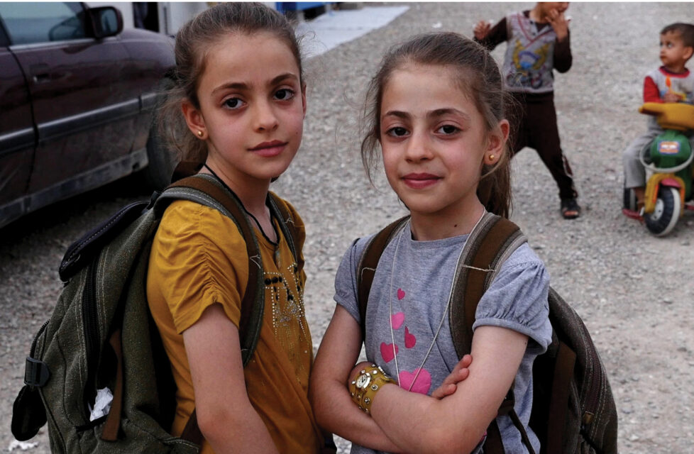11-Year-Old Girl Asks God to Forgive ISIS Two little girls looking at the camera smiling