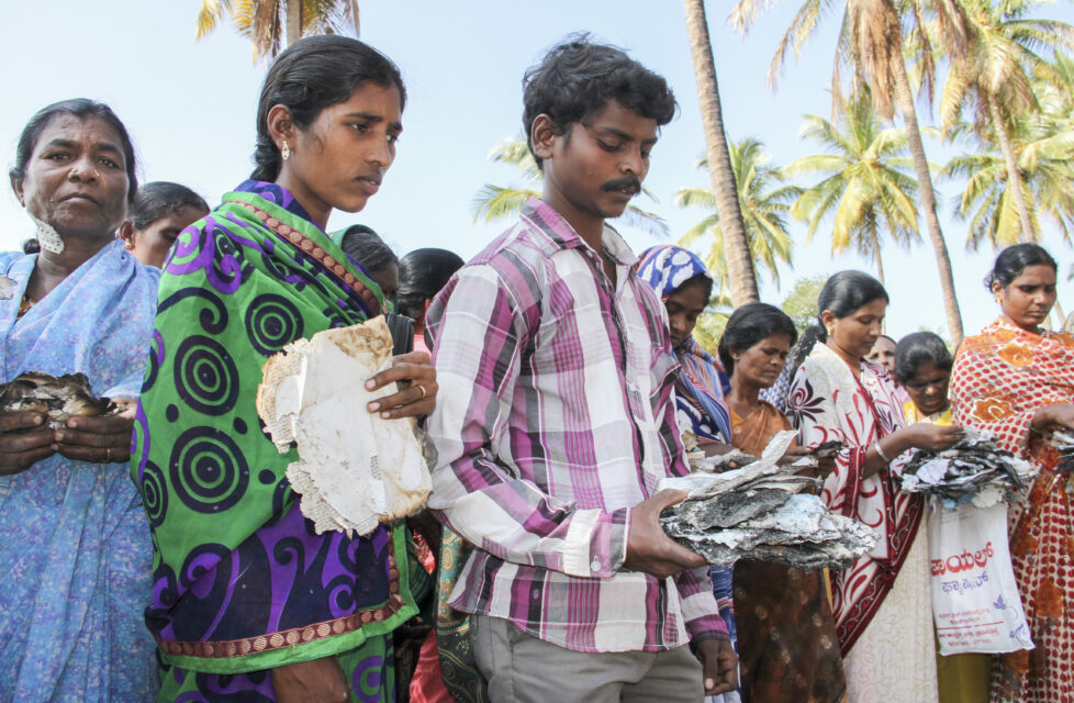 Why do persecutors destroy Bibles? People clutching scraps of burnt Bibles. President's Letter Story.