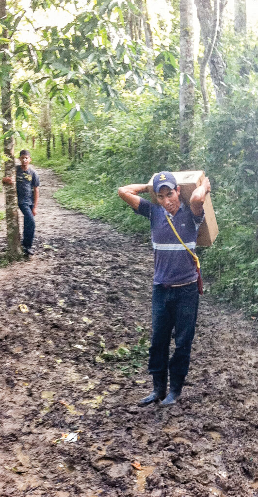 a man carrying a box of supplies